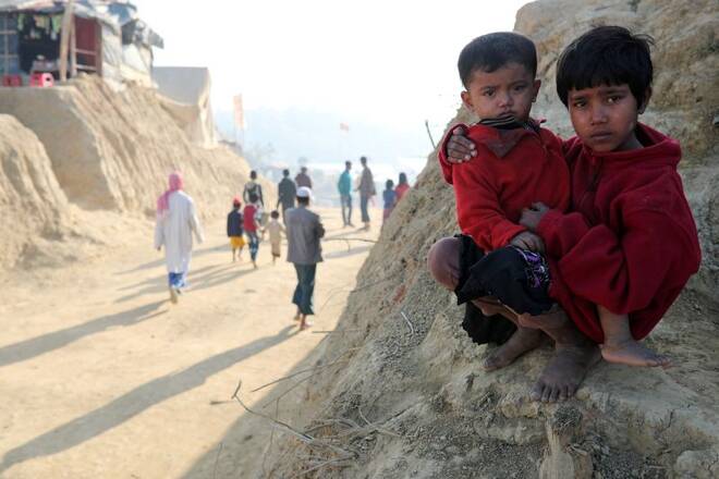 Rohingya refugee children look on at the Jamtoli camp in the morning in Cox's Bazar