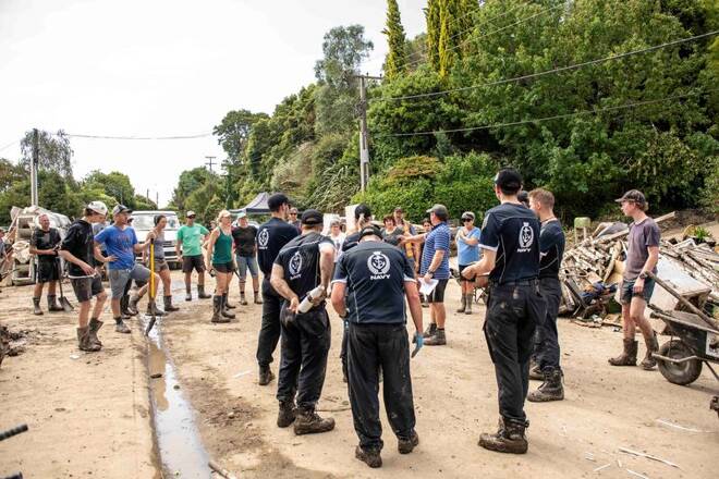 HMNZS Te Mana crew members help with a clean up in Havelock North