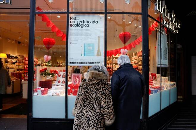 A couple looks at a shop window displaying St. Valentine's Day goods in Bilbao
