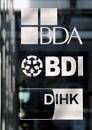 The logos of BDA, BDI and DIHK are pictured at their common headquarters in Berlin