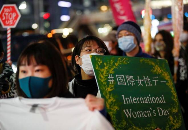 Demonstrators take part in a march for gender equality and protest against gender discrimination to mark the International Women's Day, in Tokyo
