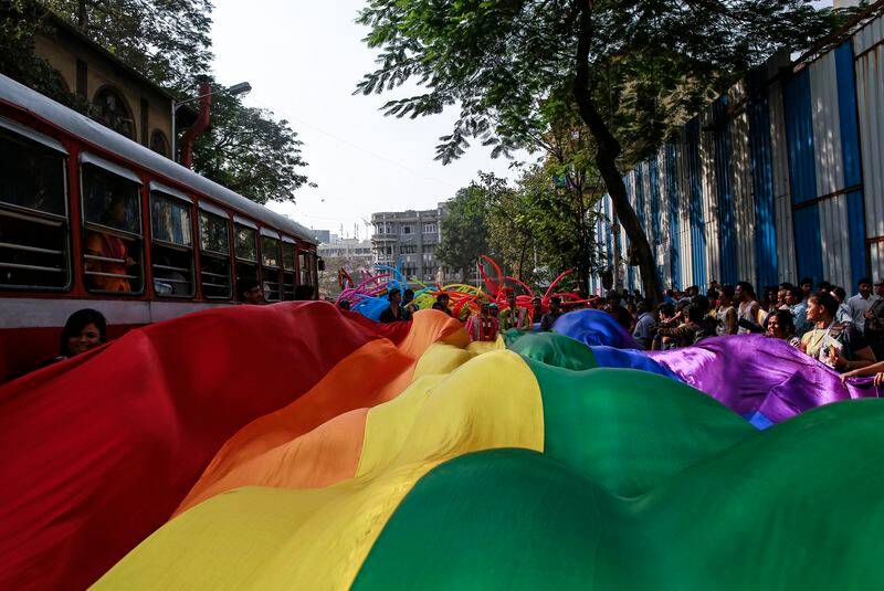 Participants hold a rainbow flag during gay pride parade, which is promoting gay, lesbian, bisexual and transgender rights, in Mumbai