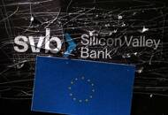 Illustration shows destroyed SVB (Silicon Valley Bank) logo and EU flag