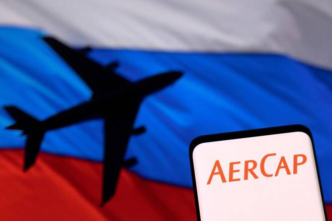Illustration shows AerCap logo displayed in front of the model of an airplane and a Russian flag