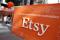 A sign advertising the online seller Etsy Inc. is seen outside the Nasdaq market site in Times Square following Etsy's IPO in New York