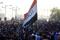 Protestors gather to mark the third anniversary of the anti-government protests in Baghdad