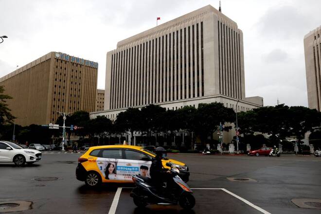 Cars drive past Taiwan's central bank in Taipei