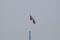 A North Korean flag flutters on top of a tower at North Korea's propaganda village of Gijungdong, as seen from Paju