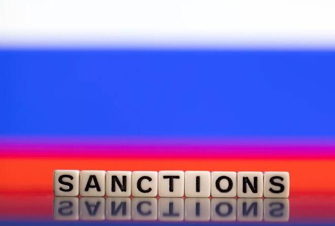 Illustration shows letters arranged to read "Sanctions" in front of Russian flag colors