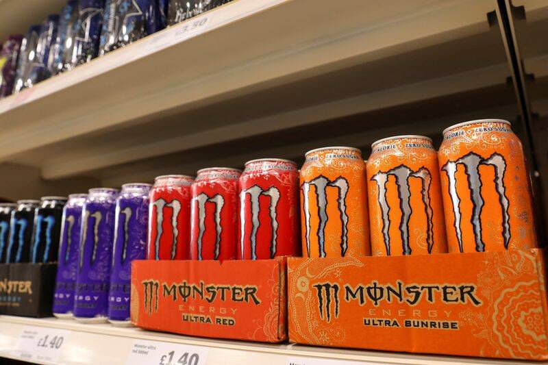 Cans of Monster energy drinks sit on display at a Sainsbury's store in London