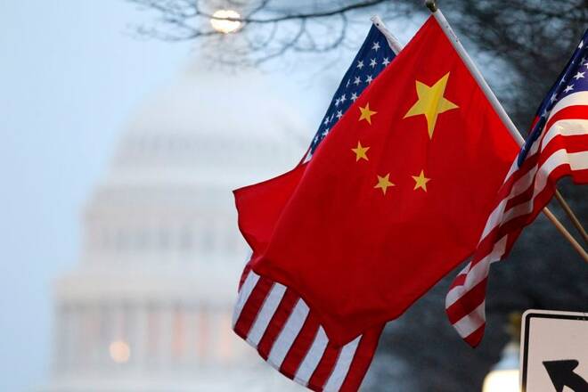 The People's Republic of China flag and the U.S. Stars and Stripes fly along Pennsylvania Avenue near the U.S. Capitol in Washington