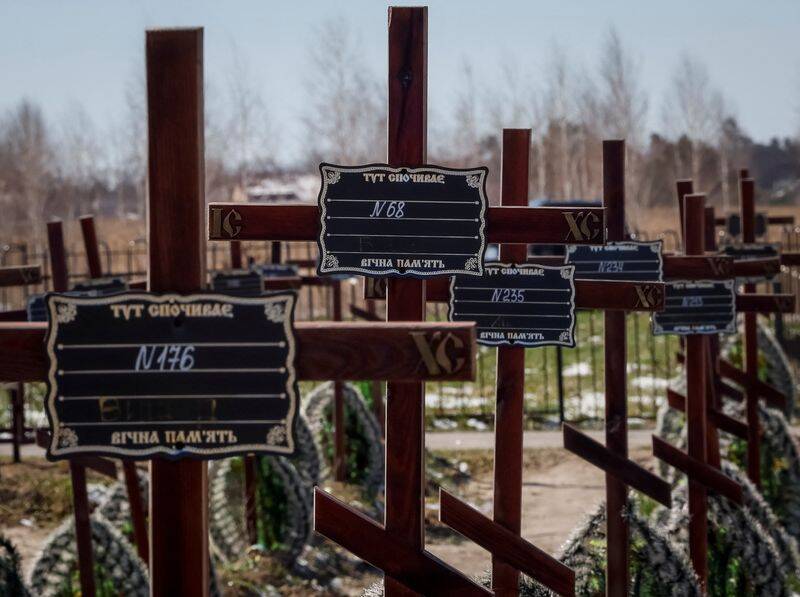 Graves of unidentified people killed by Russian soldiers during occupation of the Bucha town, are seen at the town's cemetery outside Kyiv