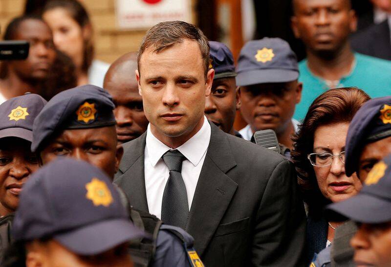 South African Olympic and Paralympic sprinter Oscar Pistorius leaves the North Gauteng High Court in Pretoria