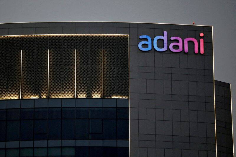 The logo of the Adani group is seen on the facade of one of its buildings on the outskirts of Ahmedabad