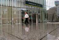 A man walks past a branch of Sumitomo Mitsui Banking Corp (SMBC) Trust Bank in Tokyo