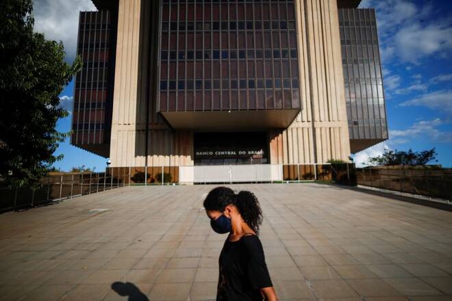 A woman walks in front the Central Bank headquarters building in Brasilia