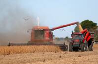 A combine harvester is used to harvest soybeans on farmland in Chivilcoy, on the outskirts of Buenos Aires