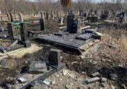 A view shows graves damaged by a Russian military strikes at a cemetery in Kharkiv