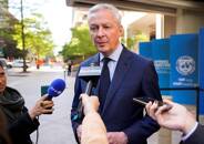 French Finance Minister Bruno Le Maire speaks to the media outside the IMF building in Washington
