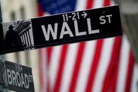 A Wall Street sign is pictured outside the New York Stock Exchange, in New York City, U.S.