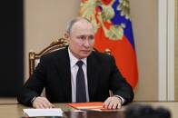 Russian President Vladimir Putin chairs a Security Council meeting in Moscow
