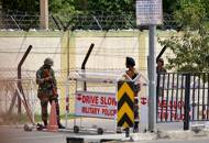 Indian army soldiers stand next to a barricade outside a military base, after a firing incident in Bathinda