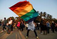 A participant waves a flag during Queer Azadi Pride, an event promoting gay, lesbian, bisexual and transgender rights, in Mumbai