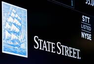 The ticker and logo for State Street Corporation is displayed on a screen at the post where it's traded on the floor of the NYSE