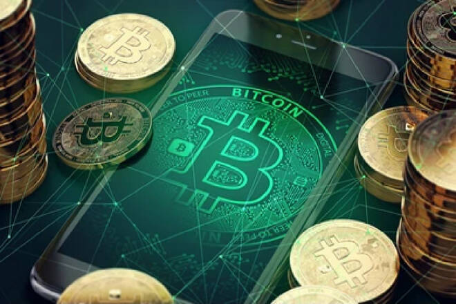 Bitcoins on a green smartphone, FX Empire