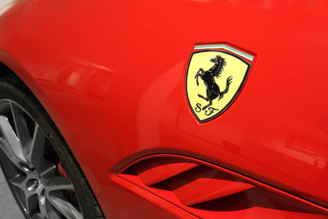 Ferrari Horse Logo Close Up on Red Car, FX Empire