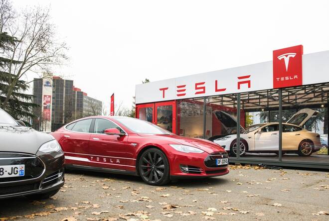 Tesla Motors dealership exterior facade. FX Empire