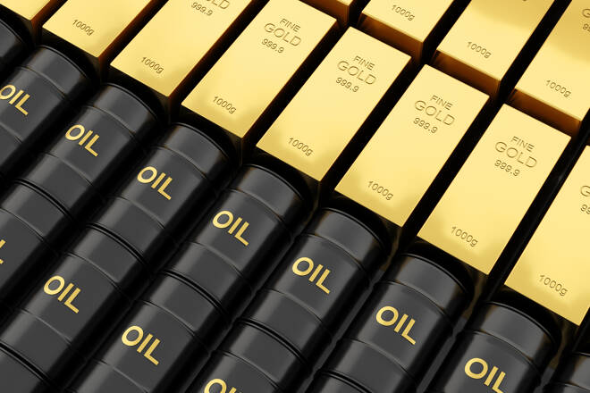 Gold bullion and crude oil barrels. FX Empire