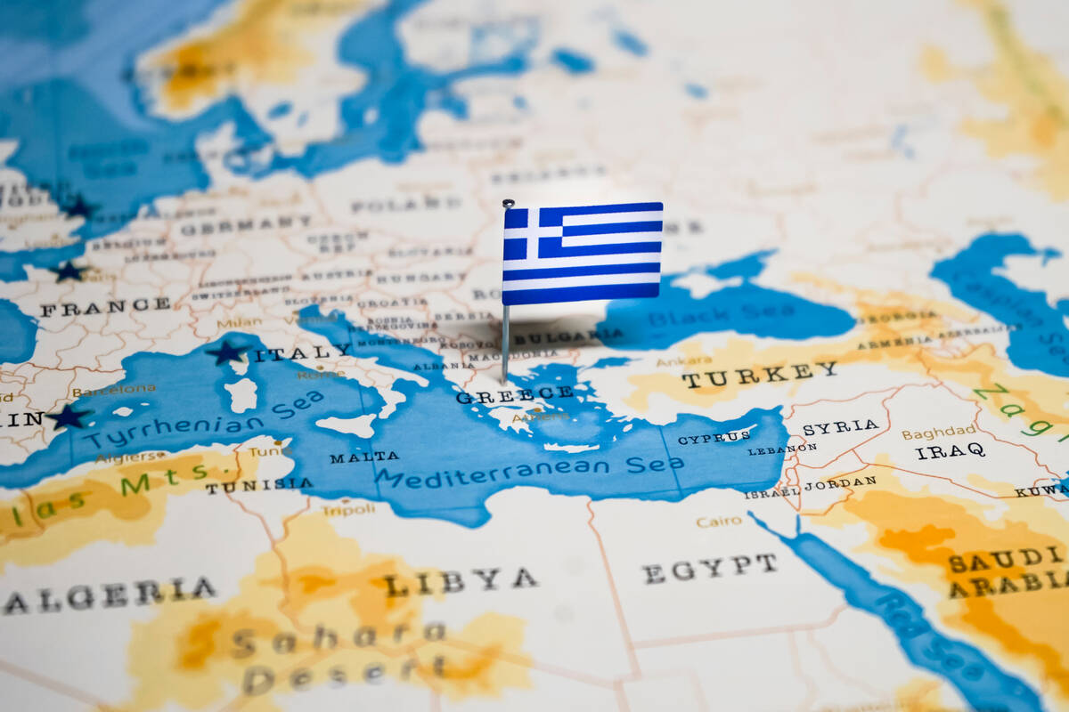 Greek flag on European map. FX Empire