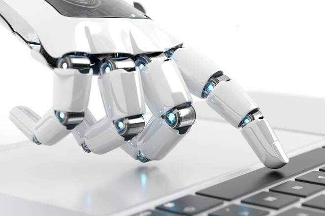 Robotic hand on a keyboard. FX Empire