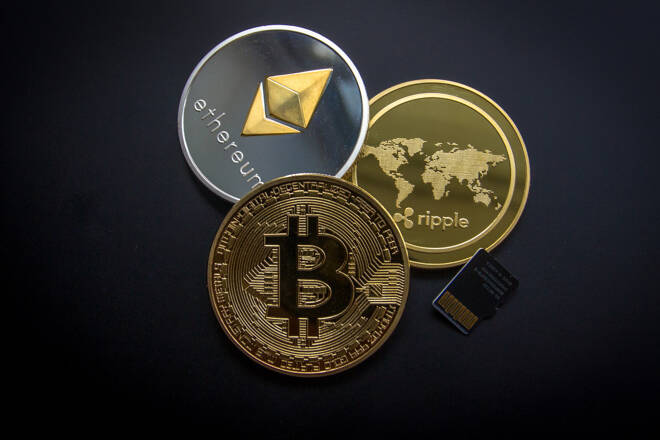 ETH, BTC and XRP coins. FX Empire