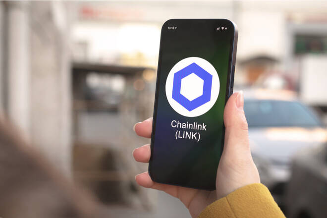 Chainlink logo in smartphone. FX Empire