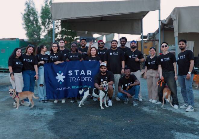 STARTRADER team and people with dogs at Animal & Us Fujairah. FX Empire