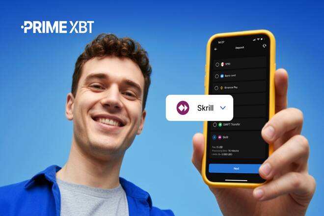 Trader using Prime XBT platform on the phone. FX Empire