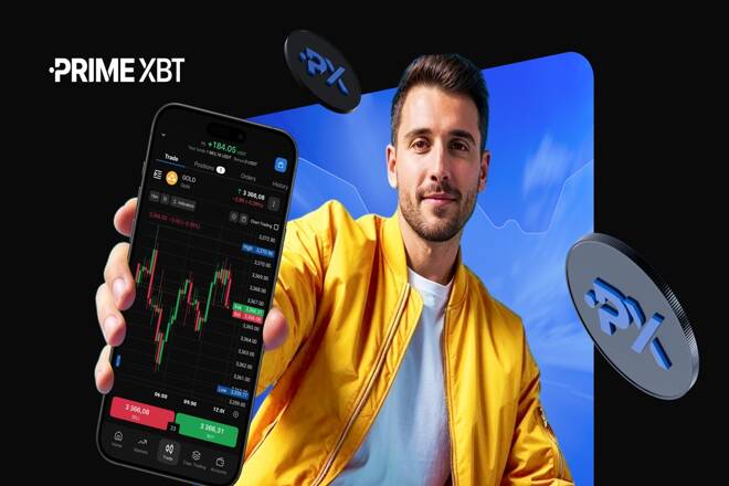 Trader using PrimeXBT platform on his smartphone. FX Empire