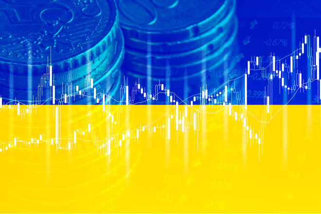 Ukraine flag, euro coins and trading chart. FX Empire