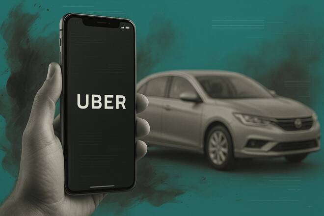 Hand holding smartphone calling a Uber and the car. FX Empire
