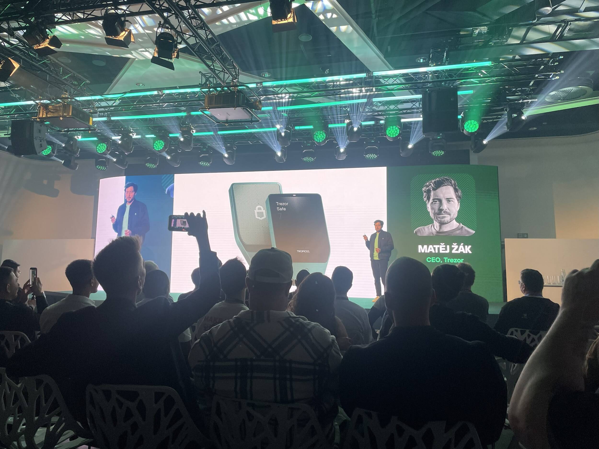 Trezor’s launch event in Prague, it shows Trezor's CEO Matej Zak giving a speech to a crowd
