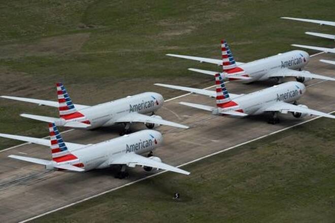 American Airlines passenger planes crowd a runway where