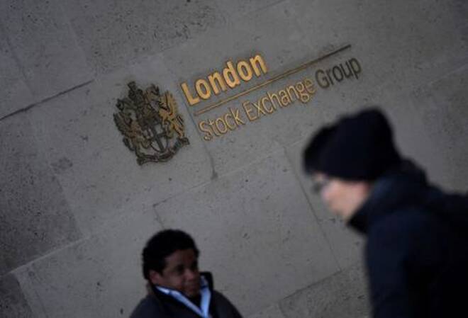 People walk past the London Stock Exchange Group offices in