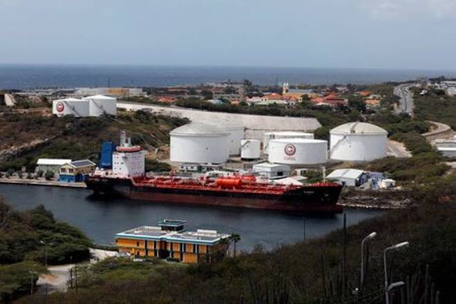 A crude oil tanker is docked at Isla
