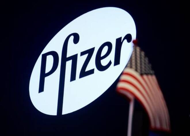 FILE PHOTO: A logo for Pfizer is displayed on a monitor on the floor at the NYSE in New York