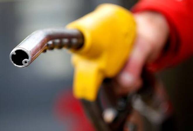 FILE PHOTO: A petrol station attendant prepares to refuel a car in Rome