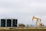 FILE PHOTO: A TORC Oil &amp; Gas pump jack near Granum, Alberta, in Canada