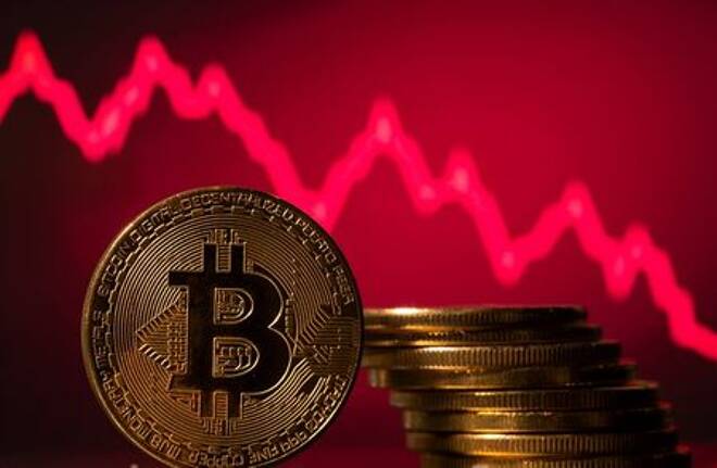A representations of virtual currency Bitcoin is seen in front