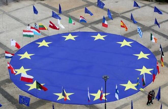 FILE PHOTO: EU flag lies at Schuman square on eve of Europe Day in Brussels